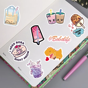 Cute boba tea stickers displayed on a notebook page with waterproof kawaii designs