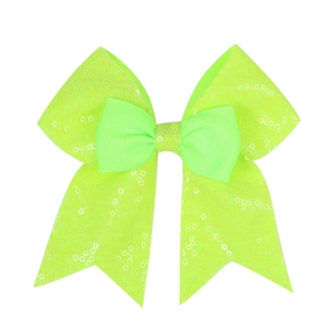 Detail of neon green sequin bow hair clip with mesh fabric and double layered design