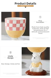 Detail of hand-painted ceramic goblet with checkered pattern and 3D bear stand design