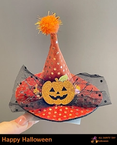Detail of mini orange sequin witch hat hair clip with pumpkin and mesh bow for Halloween