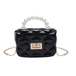 Kids black jelly handbag with quilted pattern and pearl handle on white background