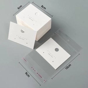 Detailed size view of white jewelry card tags 6x8cm with transparent plastic bags