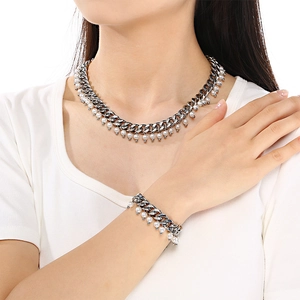 Elegantly worn 9mm silver Cuban chain jewelry set with lustrous white pearl pendants