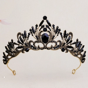 Macro detail of luxury gold bridal crown featuring vintage black crystal flower embellishments
