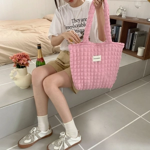 Close-up of pink waffle texture fabric on a large canvas shoulder tote bag