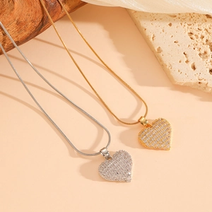 Elegant gold and silver heart necklaces with sparkling pave zircons on flat snake chains