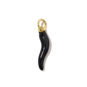 Macro detail of a black Italian Cornicello pendant with a polished gold top ring charm
