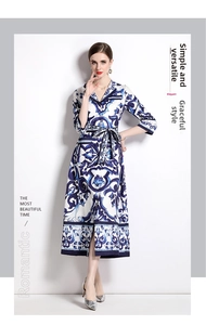 Detail of blue floral porcelain print on white V-neck maxi dress with belt