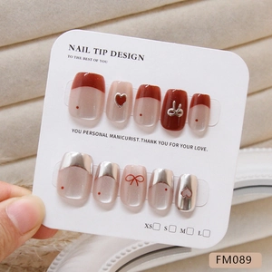 Handmade cat eye press-on nails with silver hearts and red bows in short length style