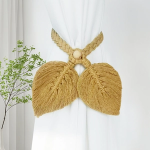 Bohemian mustard yellow woven leaf curtain tieback with wooden bead on white curtain