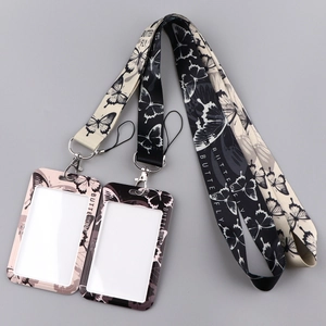 Detail of butterfly print ID badge holders with matching lanyards in black and beige