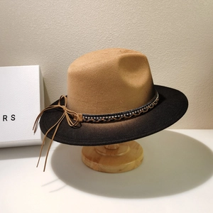 Detail of felt fedora hat featuring rhinestone woven band and brown black gradient