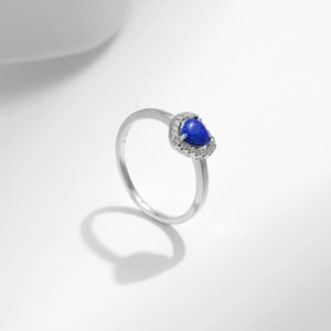 Elegant 925 sterling silver ring with a heart-shaped blue opal and sparkling stones