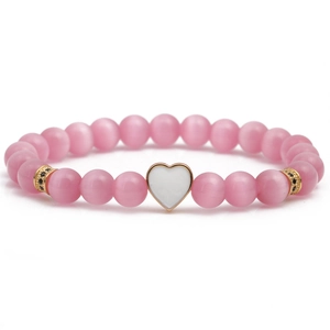 Pink cat eye stone beaded bracelet with gold micro-pave heart charm on white background