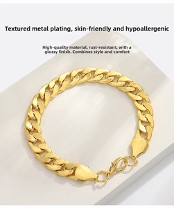 Detail of gold Cuban link bracelet showing smooth metal plating and lobster clasp closure