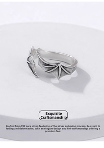 Macro shot of 999 sterling silver dragon wing ring with vintage oxidized finish details