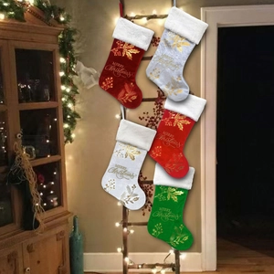 Set of five plush Christmas stockings in red, white and green with gold embroidery