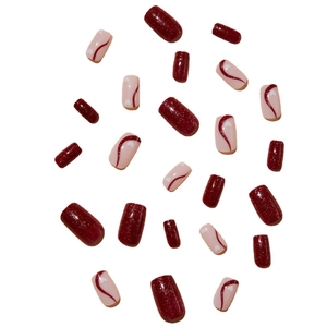 Sparkling dark red blush press-on nails with glitter and wave patterns on white background