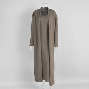 Detail of mocha knitted long cardigan and matching sleeveless maxi dress set for women