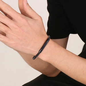 Men's black stainless steel twisted cable bracelet with a sleek metal bar on the wrist