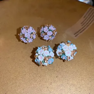 Floral cluster stud earrings with ceramic flowers and silver needles in pink and blue