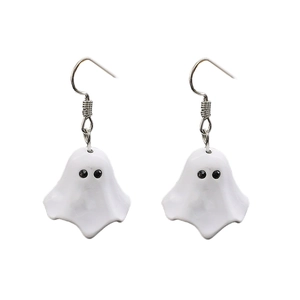 Detail shot of white ghost pendant earrings with black eyes and silver metal hooks