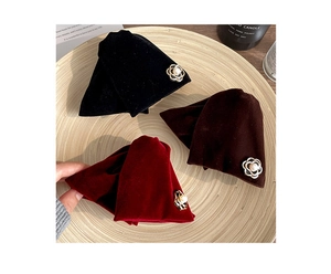 Detail of velvet triangle claw clips in black, brown and red with pearl flower accents