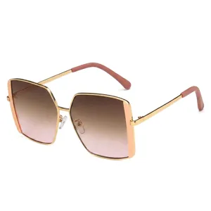 Fashionable oversized square metal sunglasses with gold frames and gradient tinted lenses