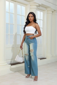 Detail of light blue high-waisted distressed wide-leg jeans with knee and thigh rips