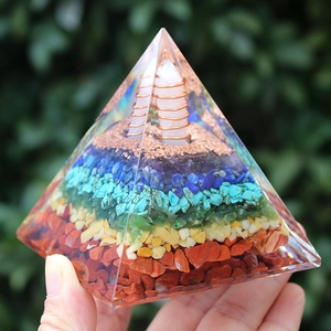 Handheld Orgone pyramid with colorful crystal stones, resin crafts, and copper coil energy