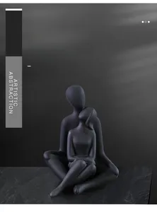 Detail of modern black matte abstract couple sculpture with artistic embrace texture
