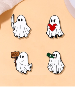 Detail view of four cute ghost enamel pins with festive Halloween designs and pin backs