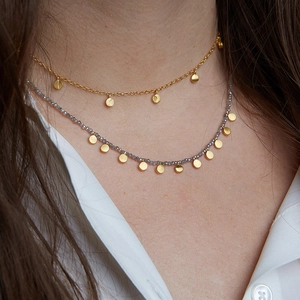 Double-layered 18k gold-plated necklace featuring beaded chain and polished disc pendants