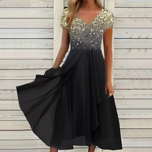 Detailed view of black dress featuring gold sequins, V-neck design and chiffon skirt