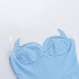 Detail of light blue pointed sweetheart neckline with transparent straps on mini dress