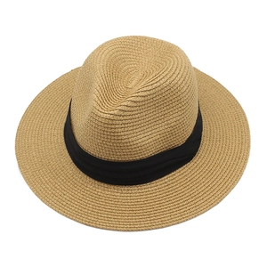Detailed top view showing the natural woven texture and black ribbon of a Panama straw hat