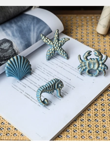 Detail of Mediterranean ocean style cabinet handles with sea star and crab motifs