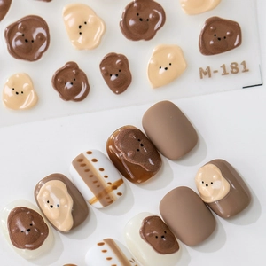 3D embossed bear nail stickers in warm brown and cream tones with plaid pattern