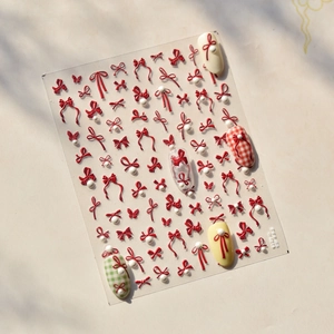 3D nail art stickers featuring red bows and white pearls with model TO-4849 design