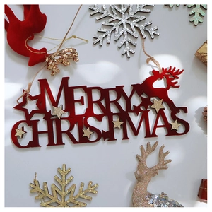 Detail of red Merry Christmas sign with gold glitter stars and reindeer silhouette