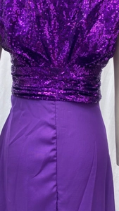 Detail of purple sequin bodice and pleated waist on elegant sleeveless evening gown