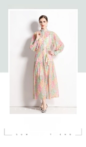 Detail of bohemian floral patchwork dress featuring a high collar and tassel drawstring waist