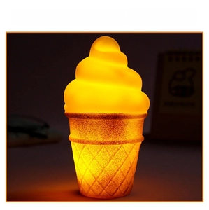 Macro shot of an ice cream night light with warm yellow glow and waffle cone texture