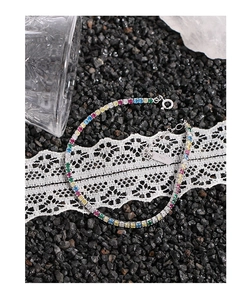 Detailed macro view of S925 sterling silver tennis bracelet with rainbow gemstones