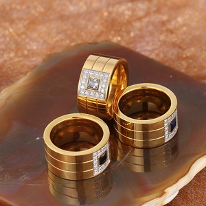 Three gold-plated stainless steel rings with square zircon stones in white, black and blue