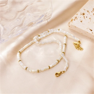 Elegant beaded necklace featuring white mother-of-pearl rectangles and gold stainless steel beads