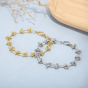 Geometric knot linked stainless steel bracelets in gold and silver with lobster clasps