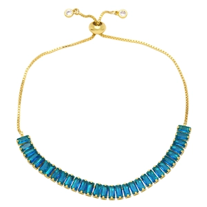 Detail of adjustable gold box chain bracelet with rectangular blue zircon inlays