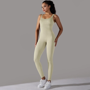 Detail showing seamless ribbed knit texture of slim fit yoga bodysuit in light beige