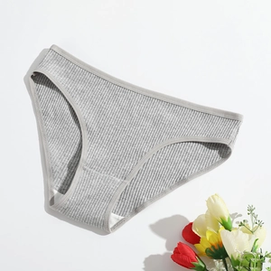 Close-up of gray ribbed cotton panties for women with soft texture and floral decor